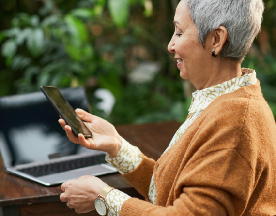 Smiling person browsing a secure website with an SSL certificate, representing user trust and data safety.